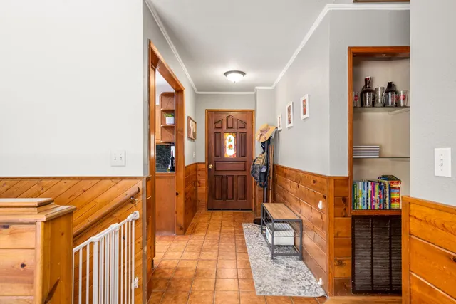 a kitchen with stainless steel appliances granite countertop a refrigerator a sink dishwasher a stove with wooden cabinets and floor