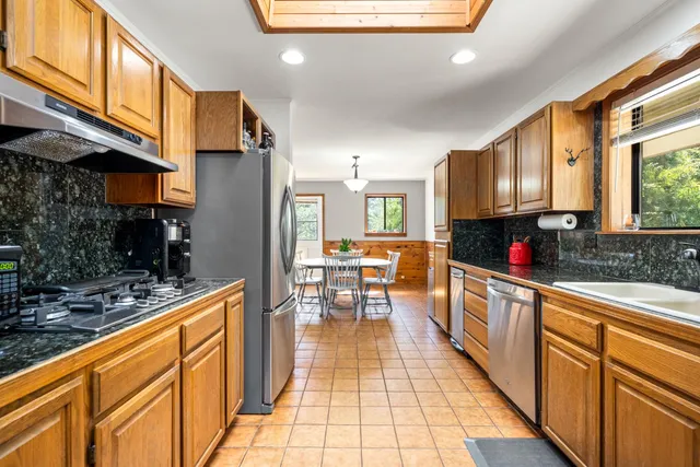 a view of a dining room with furniture and window