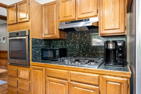 a living room with furniture pool table and a window