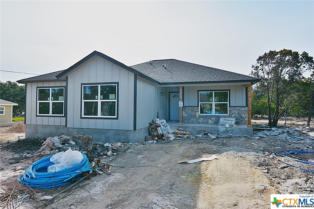 a front view of a house with sitting area