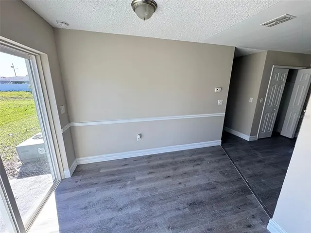 a view of an empty room and window