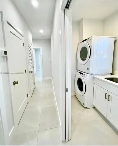 a view of a kitchen with a washer and dryer
