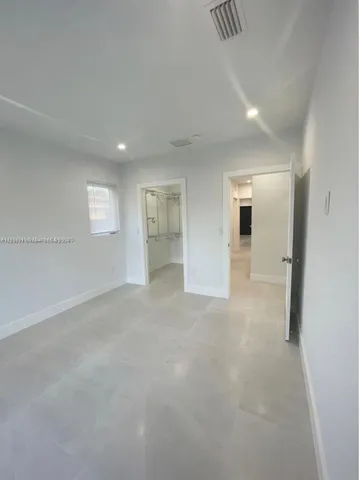 a view of a livingroom and entryway