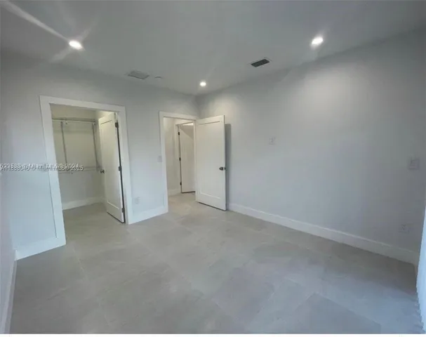 an empty room with an entryway