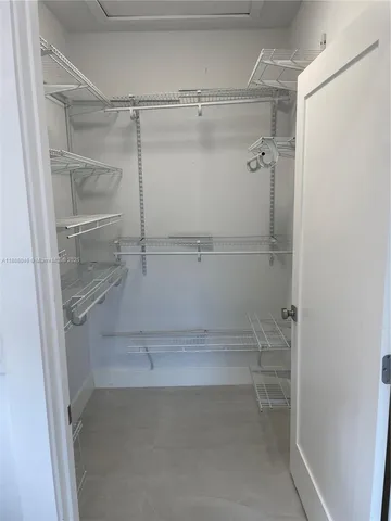 a empty closet with white paint