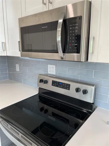 a close view of kitchen sink and stove