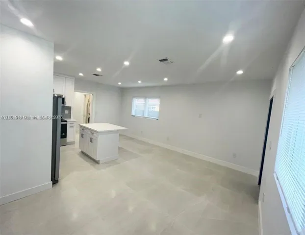 a view of a room with air conditioner and window