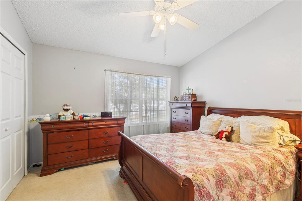 291 Countryside Key Boulevard Oldsmar, FL 34677 - Photo 14 of 34 a bedroom with a bed and a dresser