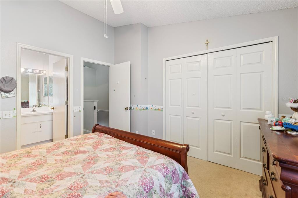 291 Countryside Key Boulevard Oldsmar, FL 34677 - Photo 15 of 34 a bedroom with a bed and a sink