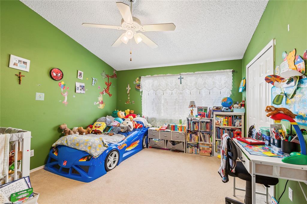 291 Countryside Key Boulevard Oldsmar, FL 34677 - Photo 17 of 34 a bedroom with furniture and a bed