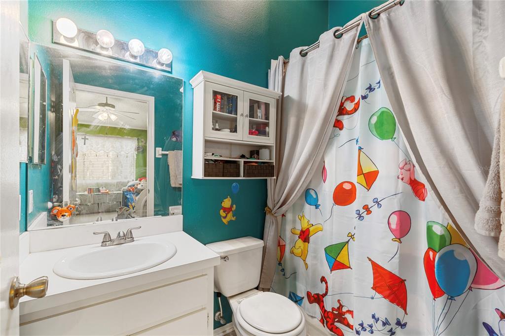 291 Countryside Key Boulevard Oldsmar, FL 34677 - Photo 20 of 34 a white sink and a bathroom with a sink curtain