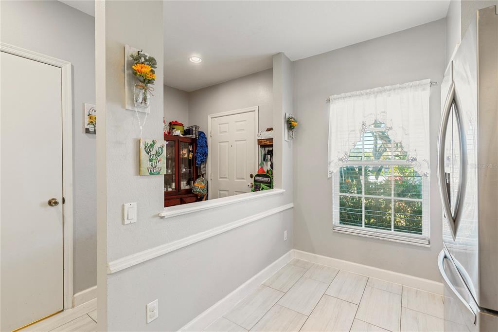 291 Countryside Key Boulevard Oldsmar, FL 34677 - Photo 2 of 34 a view of hallway with furniture and a window