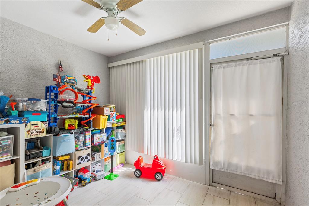 291 Countryside Key Boulevard Oldsmar, FL 34677 - Photo 22 of 34 a children room with toys and a fan