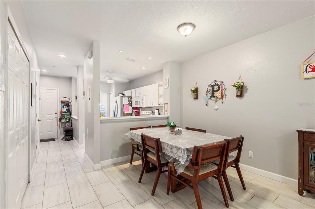 291 Countryside Key Boulevard Oldsmar, FL 34677 - Photo 8 of 34 a view of a dining room with furniture