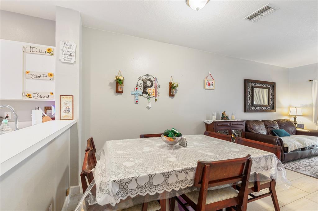 291 Countryside Key Boulevard Oldsmar, FL 34677 - Photo 10 of 34 a view of a dining room with furniture