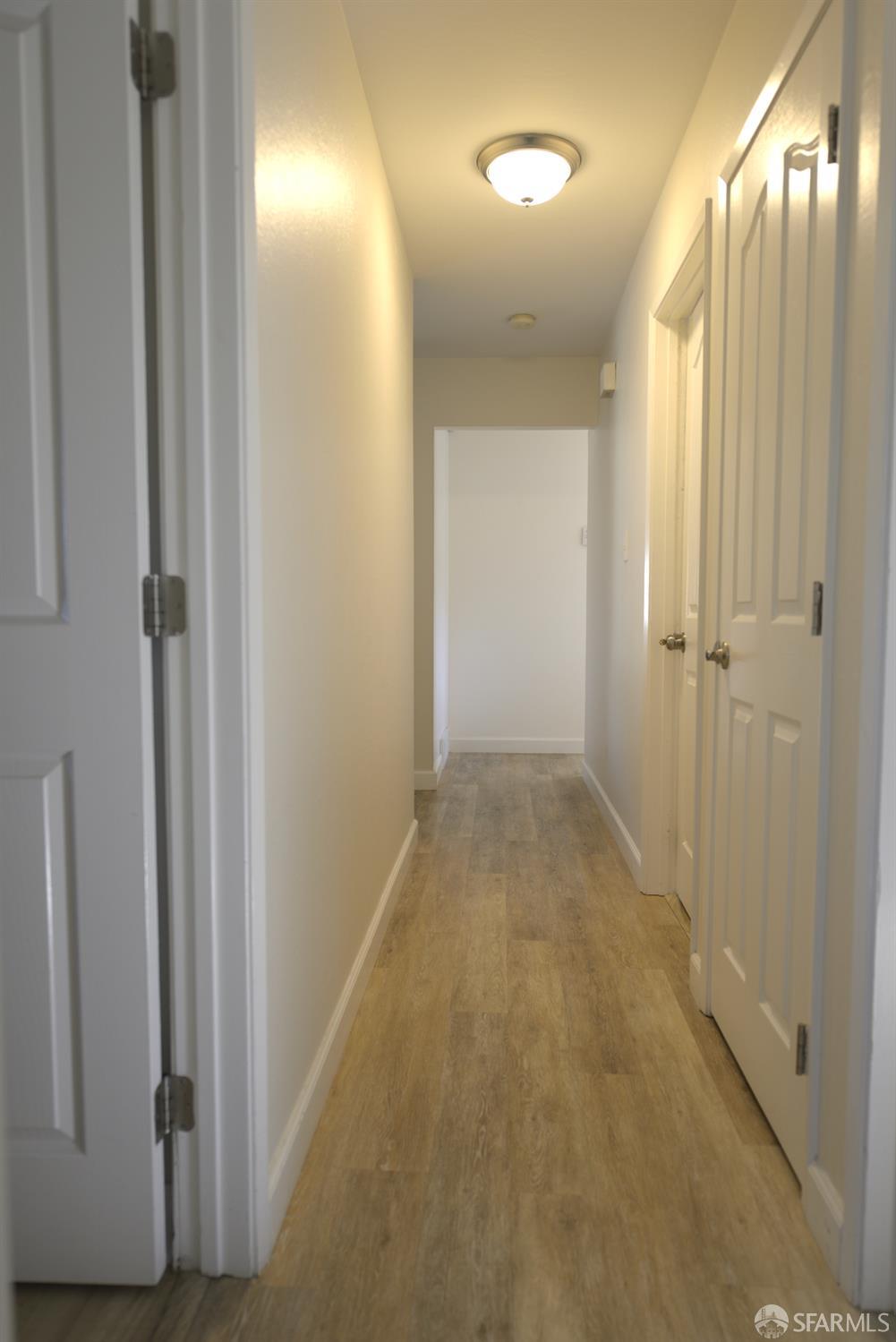 601 Garin Avenue Hayward, CA 94544 - Photo 12 of 27 a view of a hallway with wooden floor