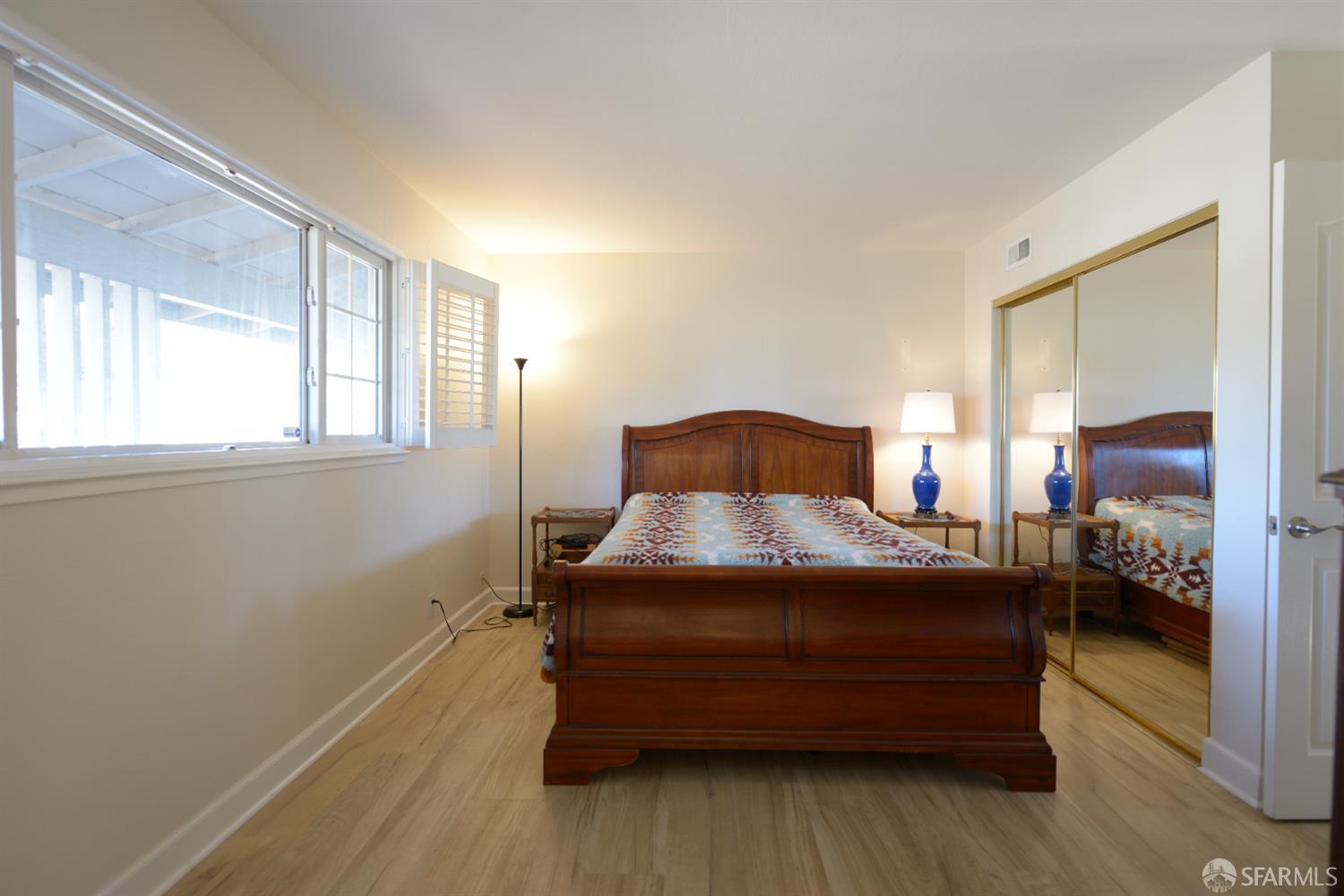 601 Garin Avenue Hayward, CA 94544 - Photo 16 of 27 a bedroom with a bed and wooden floor