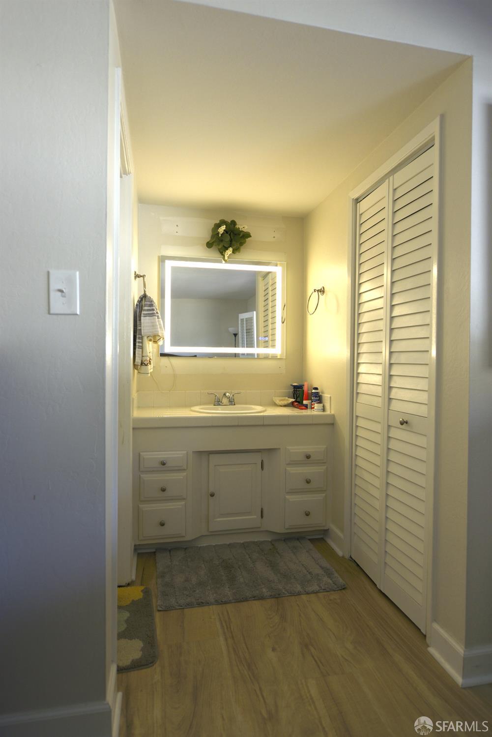 601 Garin Avenue Hayward, CA 94544 - Photo 17 of 27 a bathroom with a sink mirror and a shower