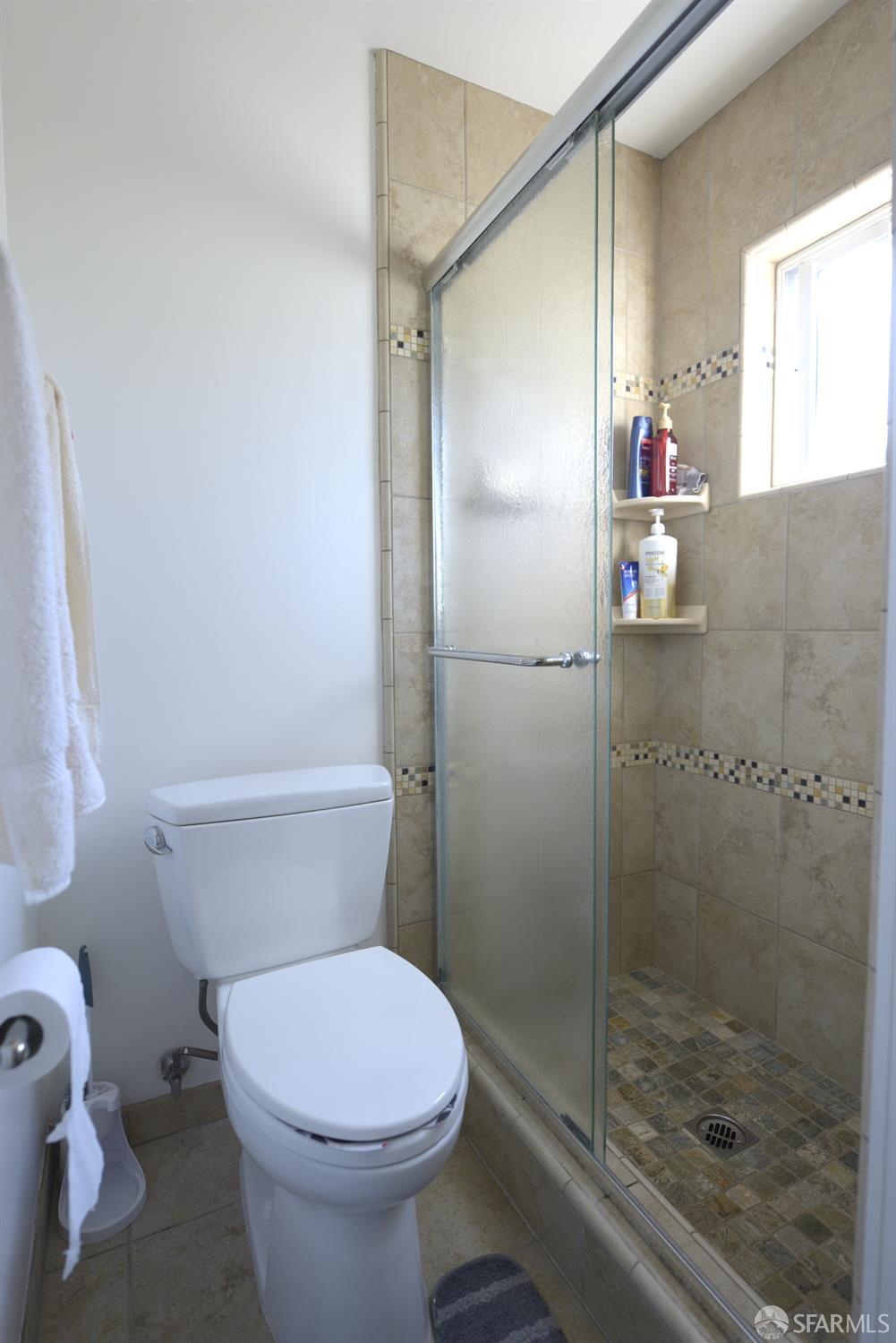 601 Garin Avenue Hayward, CA 94544 - Photo 18 of 27 a bathroom with a toilet and a shower