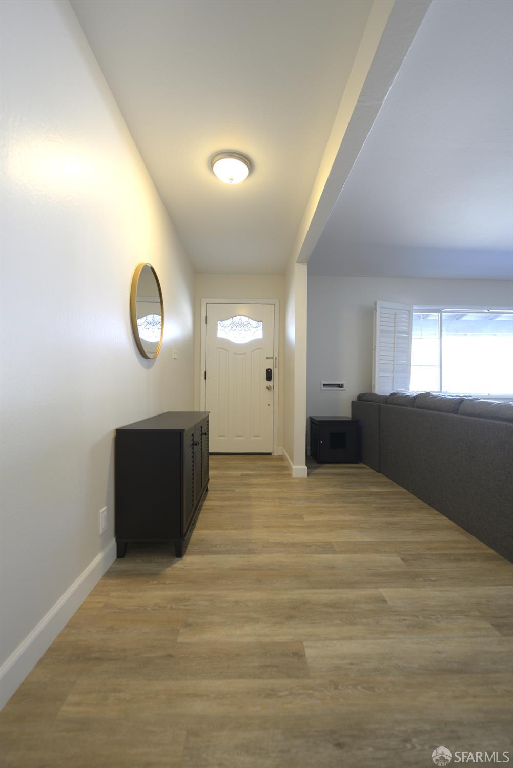 601 Garin Avenue Hayward, CA 94544 - Photo 20 of 27 a view of an empty room with wooden floor and windows