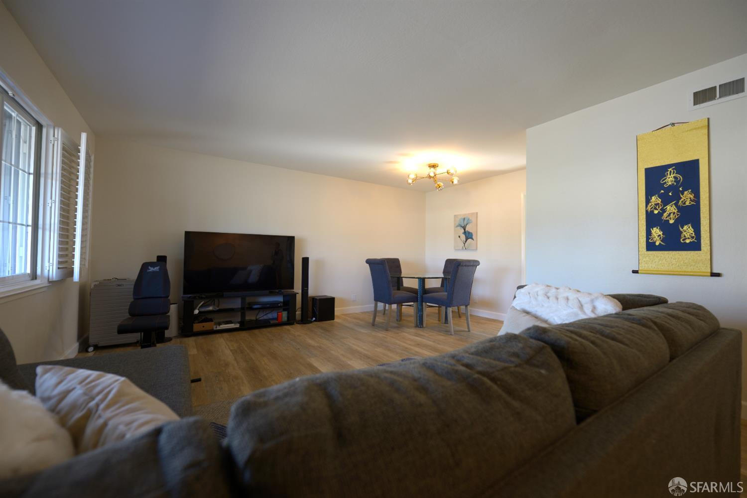 601 Garin Avenue Hayward, CA 94544 - Photo 6 of 27 a living room with furniture and a flat screen tv