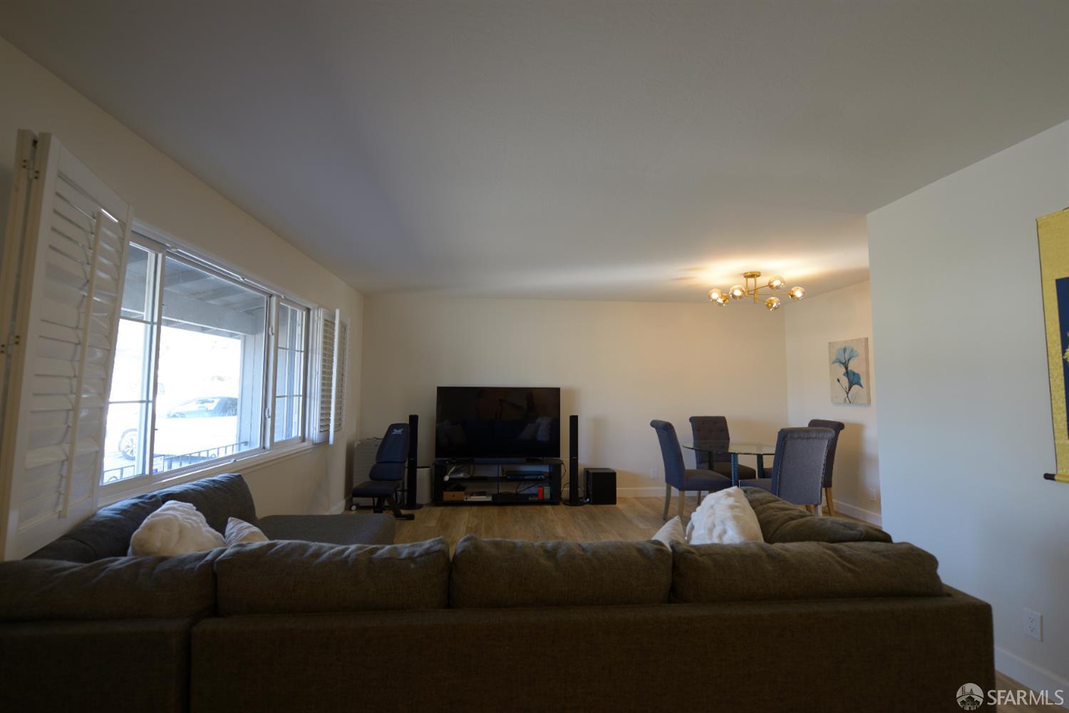 601 Garin Avenue Hayward, CA 94544 - Photo 7 of 27 a living room with furniture and a flat screen tv