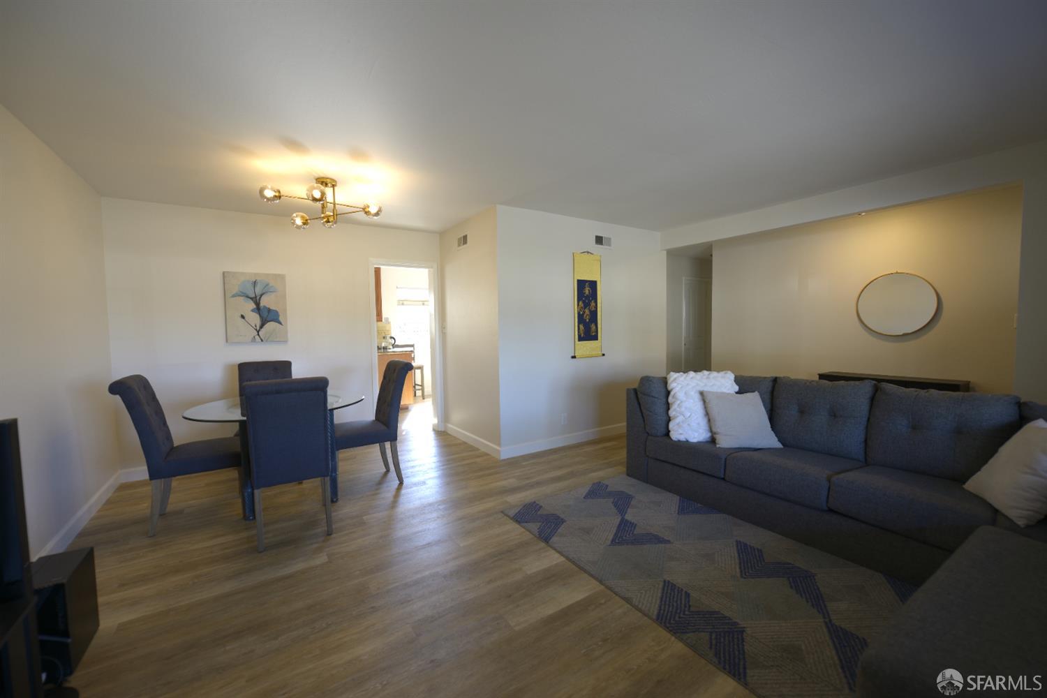 601 Garin Avenue Hayward, CA 94544 - Photo 8 of 27 a living room with furniture a lamp and wooden floor