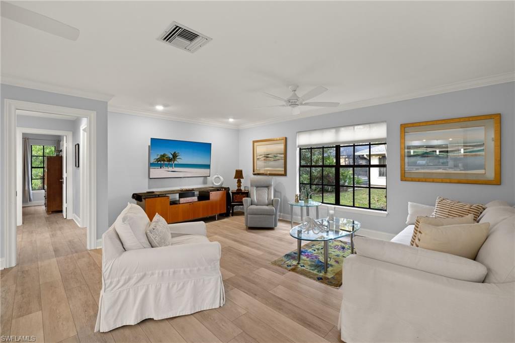 2259 Queens Way Naples, FL 34112 - Photo 15 of 29 a living room with furniture and a large window
