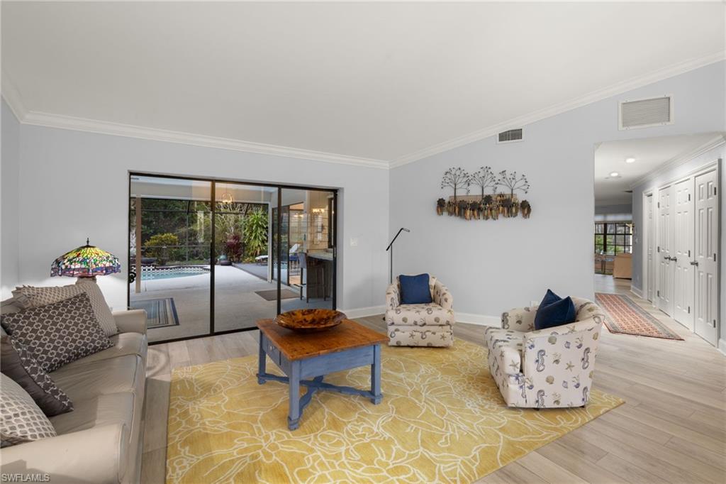 2259 Queens Way Naples, FL 34112 - Photo 7 of 29 a living room with furniture and a large window