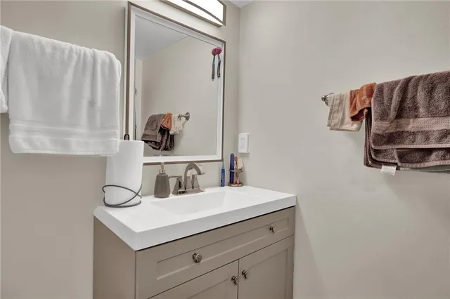 a white toilet sitting next to a shower curtain