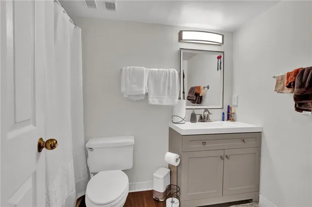 a bedroom with a bed and dresser