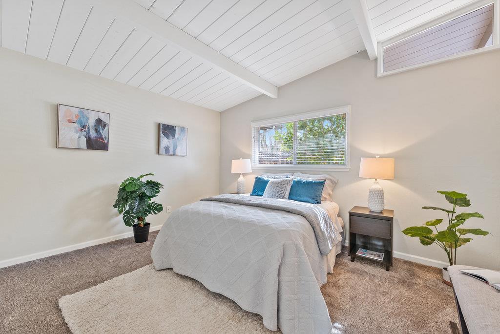 416 Semple Avenue Aptos, CA 95003 - Photo 19 of 45 a bedroom with a bed potted plant and a window