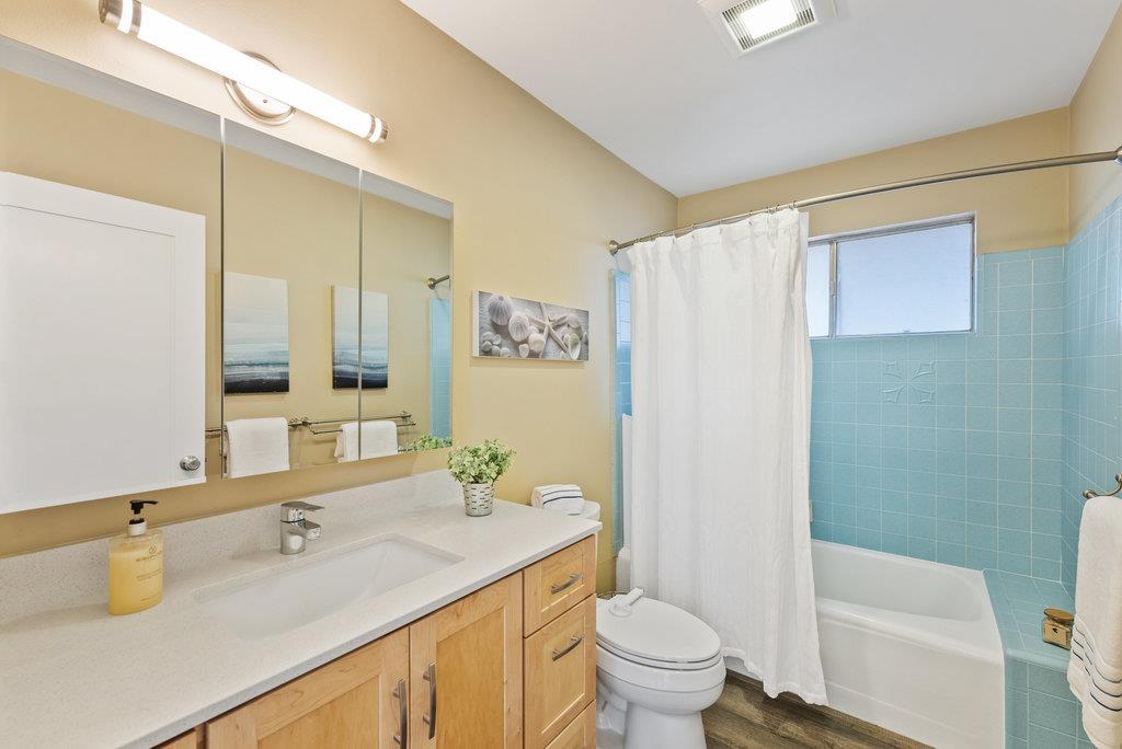 416 Semple Avenue Aptos, CA 95003 - Photo 23 of 45 a bathroom with a granite countertop sink and a mirror