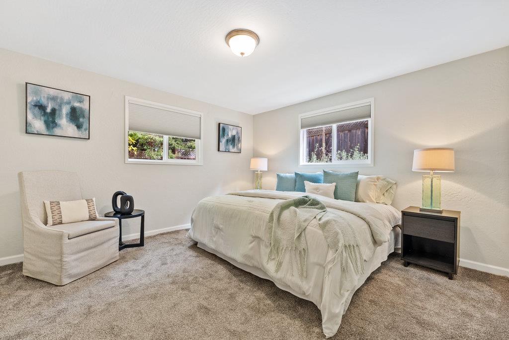 416 Semple Avenue Aptos, CA 95003 - Photo 27 of 45 a spacious bedroom with a bed and a couch