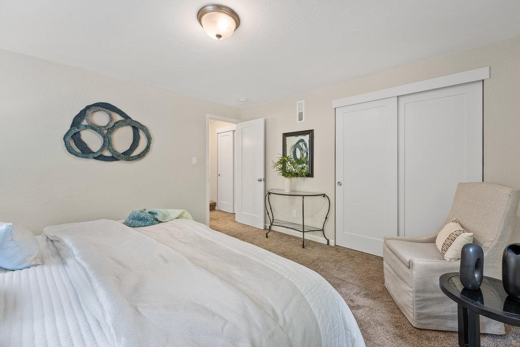 416 Semple Avenue Aptos, CA 95003 - Photo 28 of 45 a bedroom with a bed and a chair