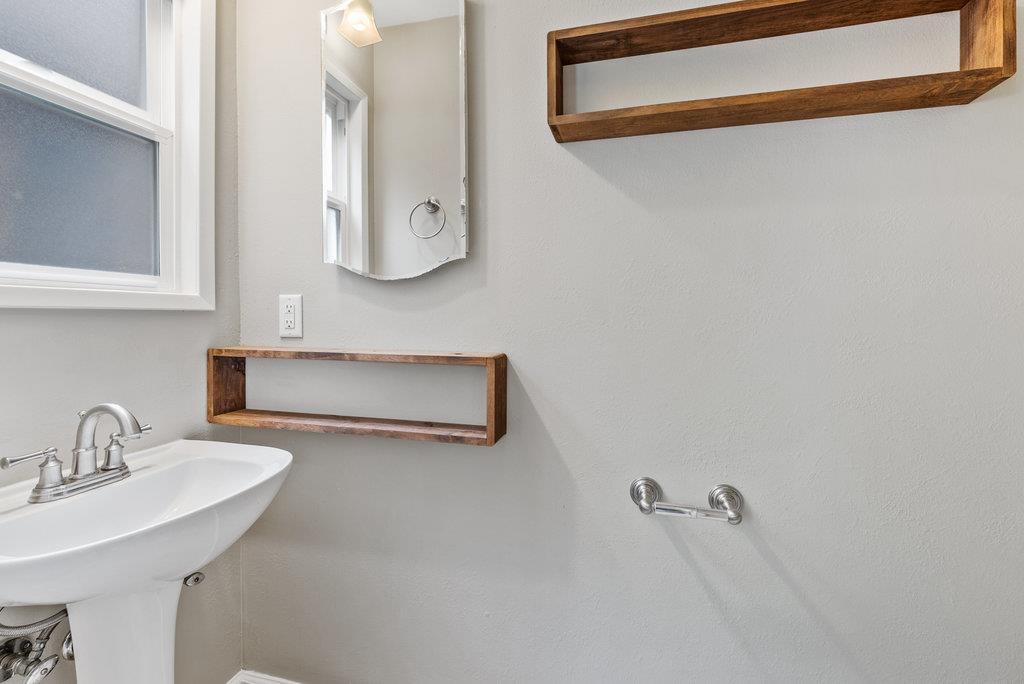 416 Semple Avenue Aptos, CA 95003 - Photo 31 of 45 a bathroom with a sink and a mirror