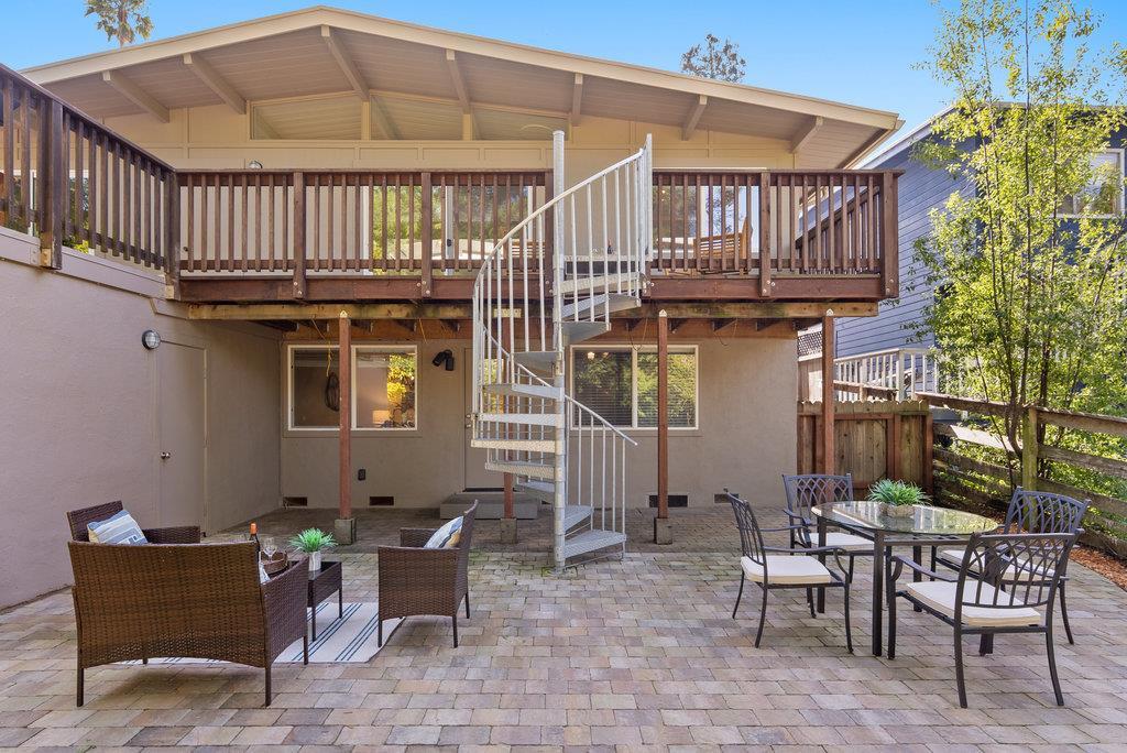 416 Semple Avenue Aptos, CA 95003 - Photo 33 of 45 a view of a patio with table and chairs with wooden fence