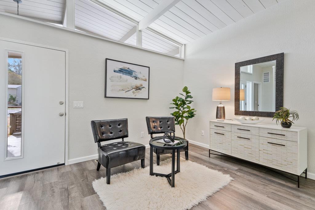416 Semple Avenue Aptos, CA 95003 - Photo 8 of 45 a living room with furniture and paintings on the wall