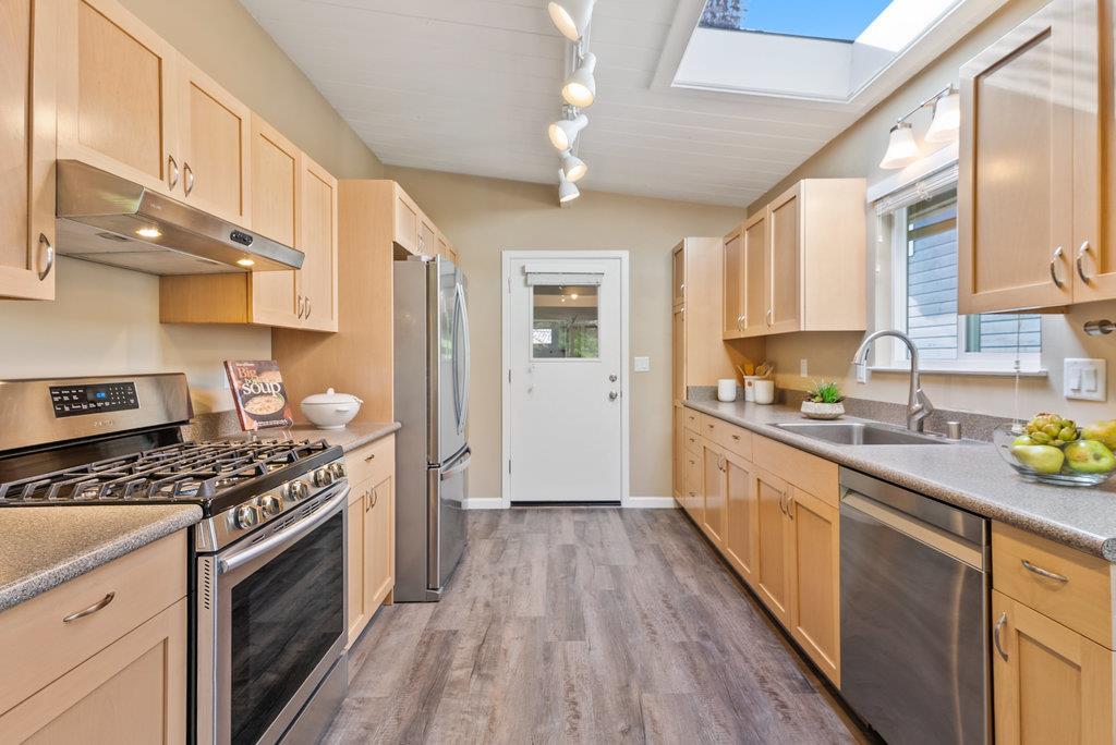 416 Semple Avenue Aptos, CA 95003 - Photo 10 of 45 a kitchen with stainless steel appliances a stove cabinets and a kitchen island