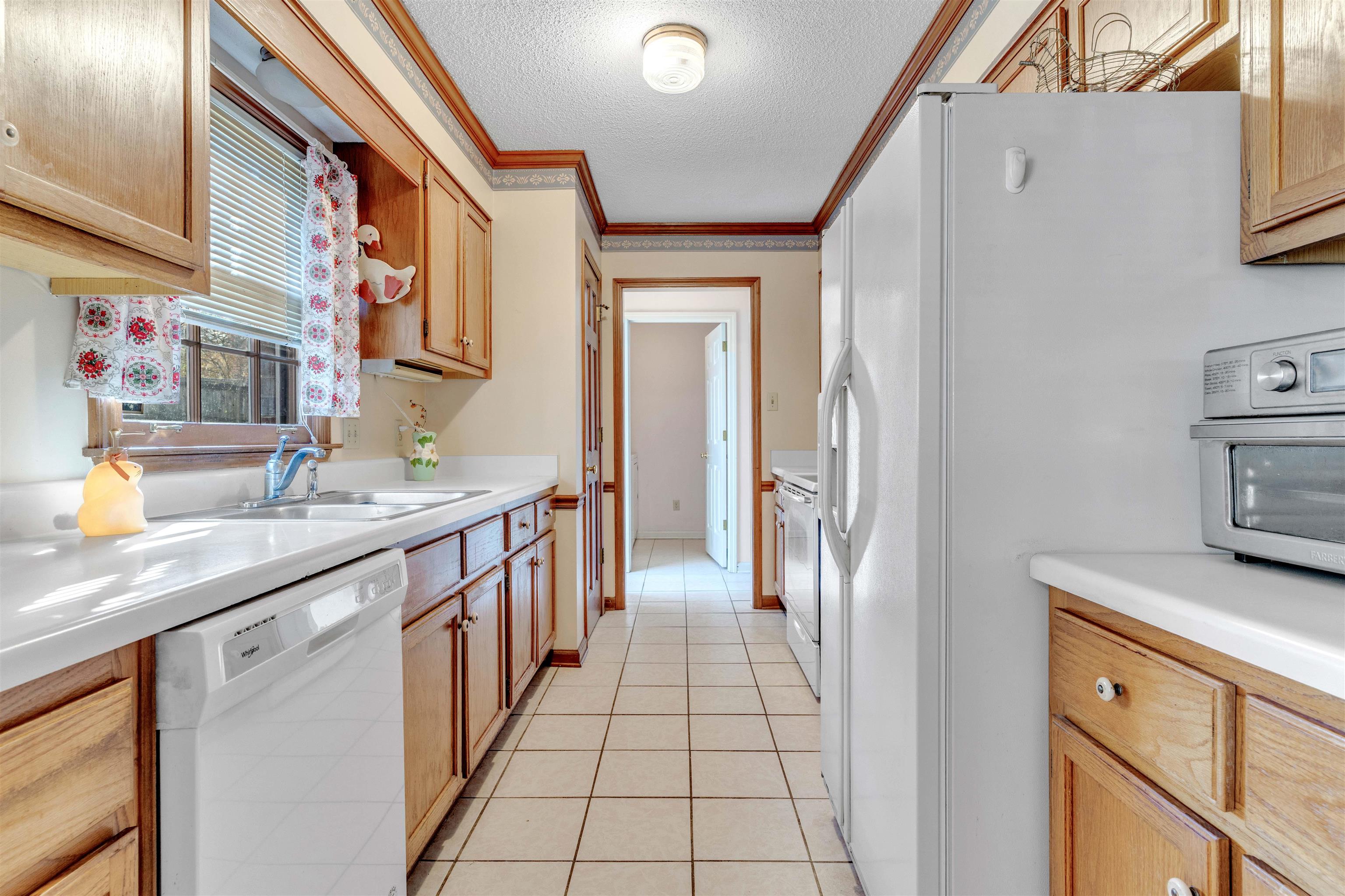 358 Wolf Trap Street Collierville, TN 38017 - Photo 16 of 24 a bathroom with a sink a mirror and a shower