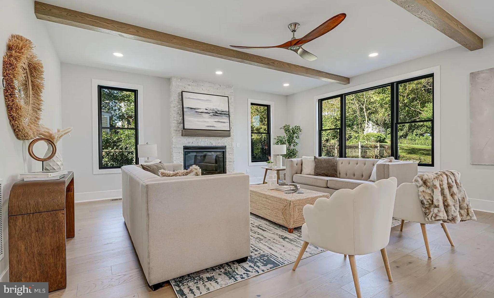 1927 Griffith Road Falls Church, VA 22043 - Photo 14 of 33 a living room with fireplace furniture and a large window
