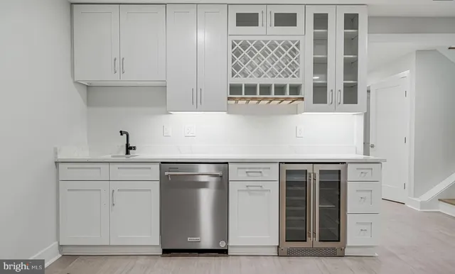 a view of an empty room with a kitchen