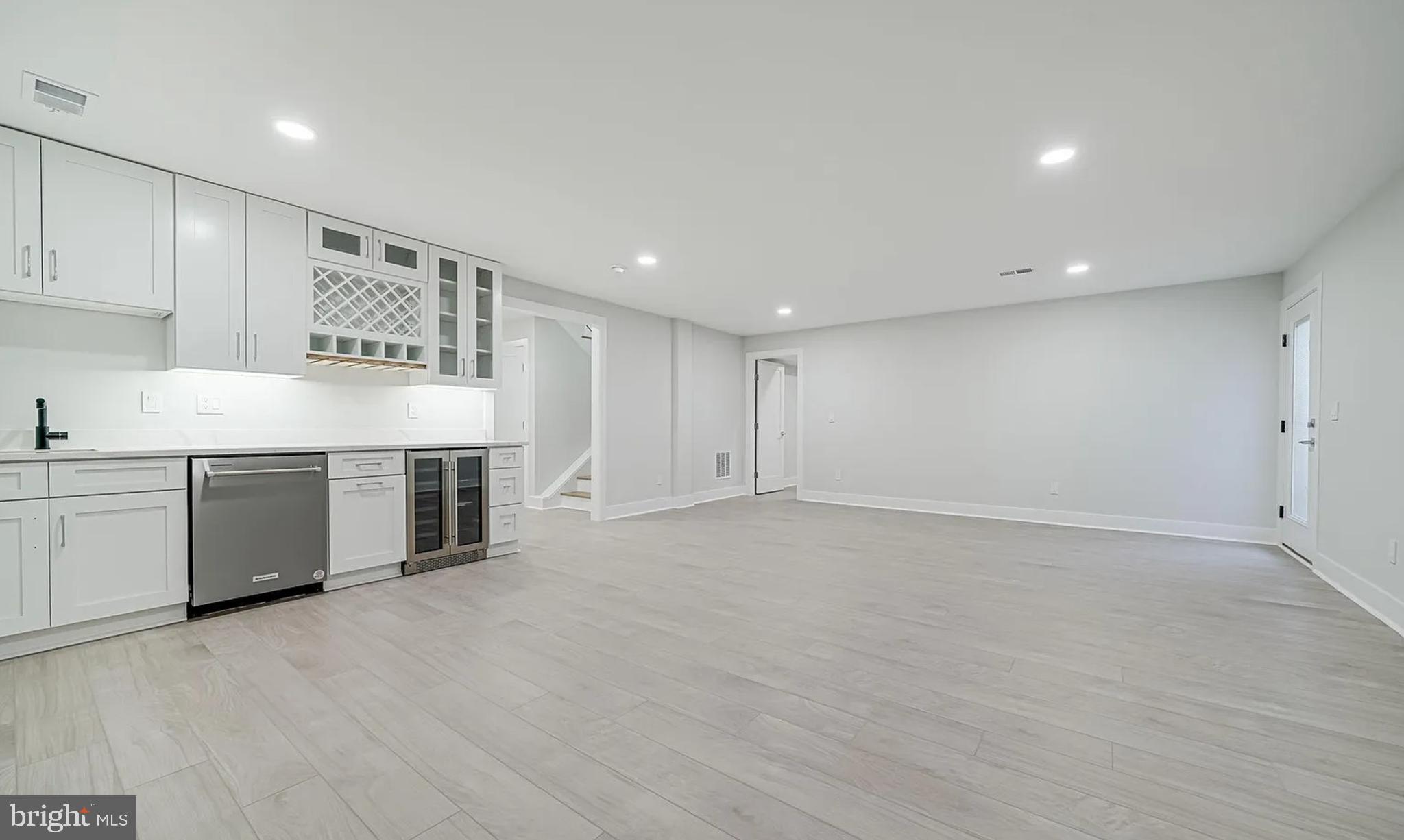 1927 Griffith Road Falls Church, VA 22043 - Photo 18 of 33 a view of an empty room with a kitchen