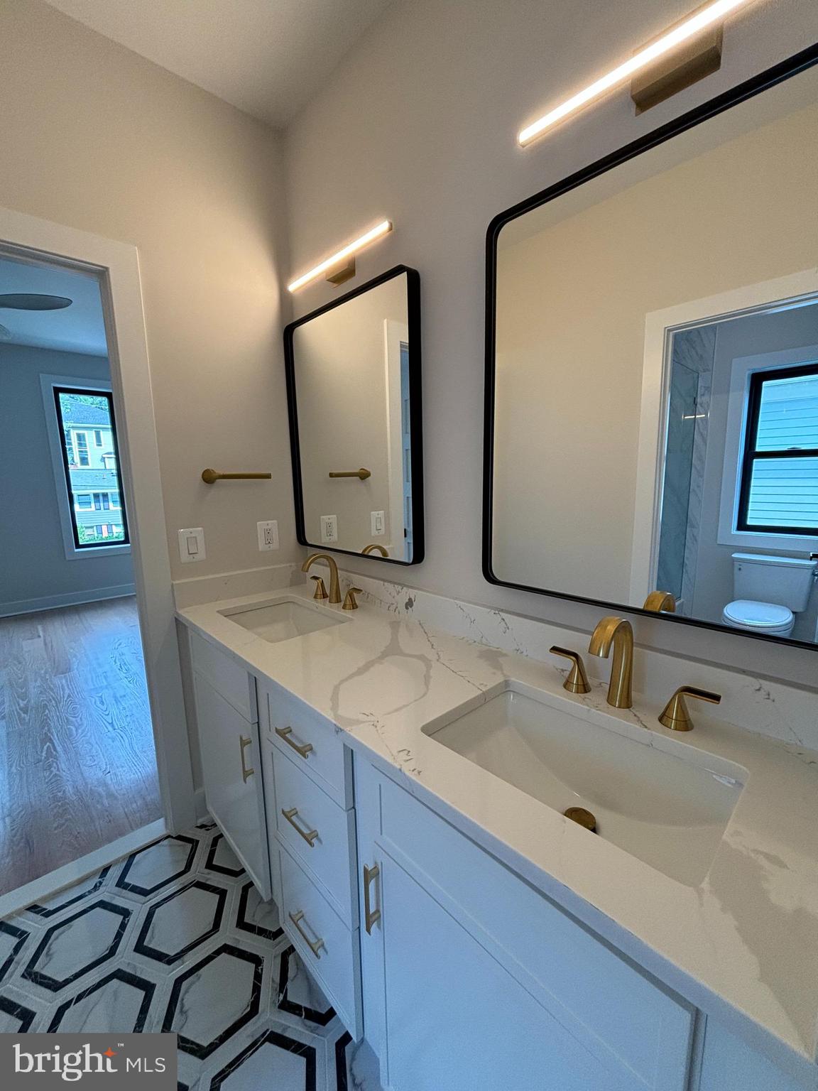 1927 Griffith Road Falls Church, VA 22043 - Photo 20 of 33 a bathroom with a double vanity sink and a mirror