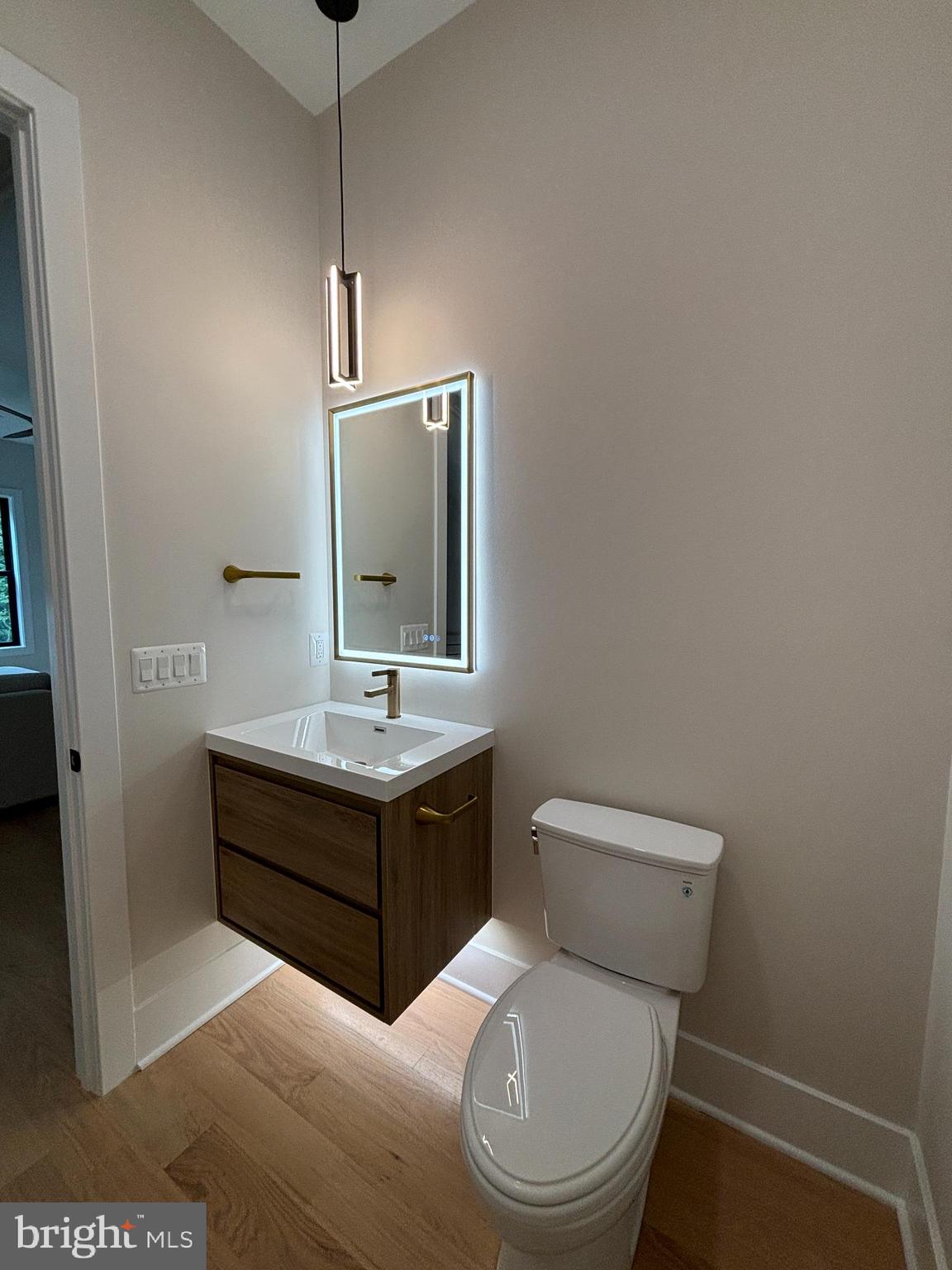 1927 Griffith Road Falls Church, VA 22043 - Photo 21 of 33 a bathroom with a toilet sink and mirror