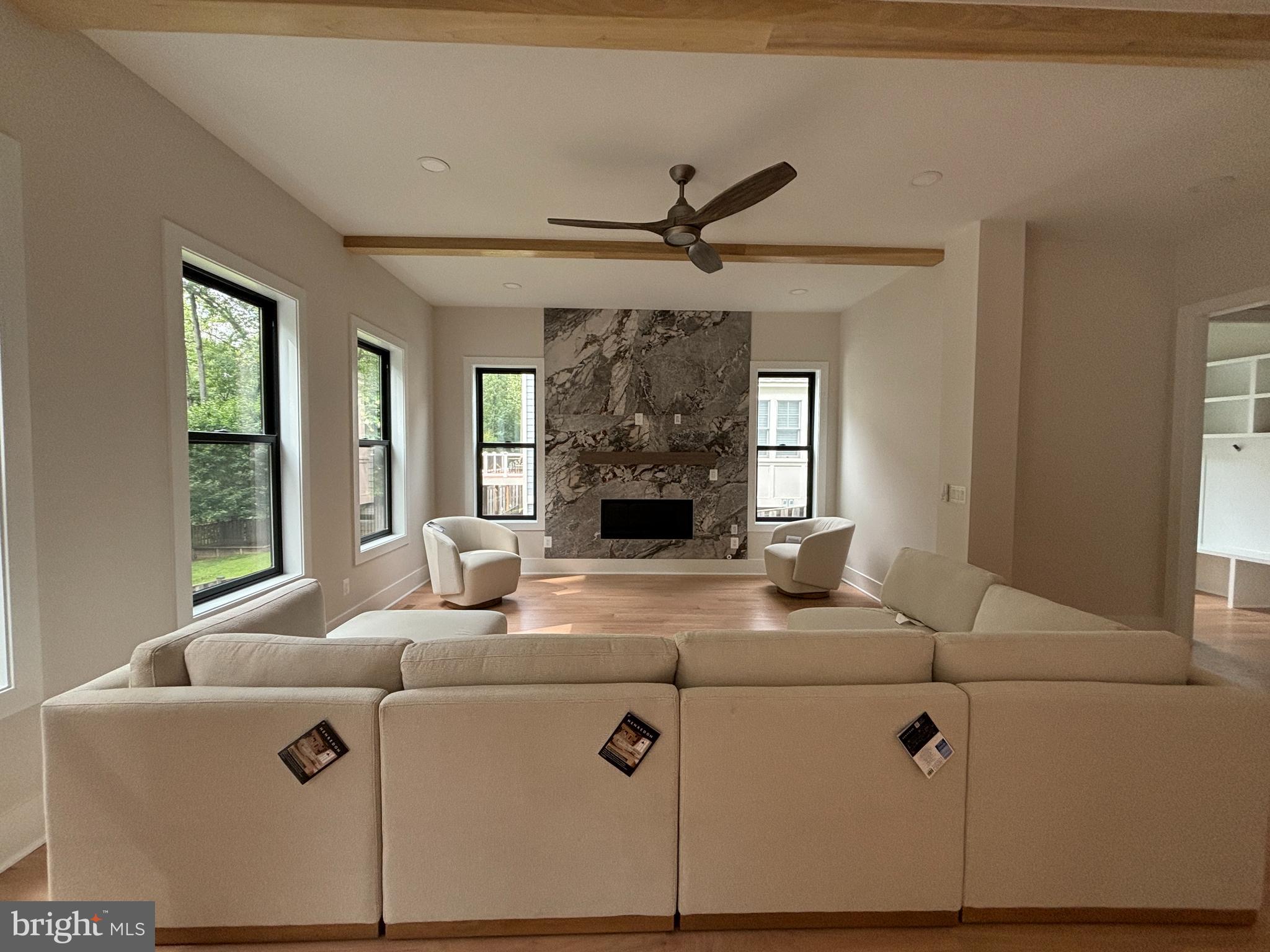 1927 Griffith Road Falls Church, VA 22043 - Photo 22 of 33 a living room with fireplace furniture and a chandelier