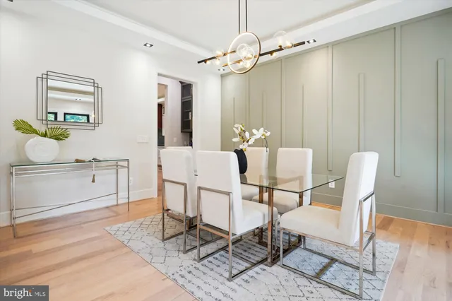 a living room with furniture fireplace and a large window