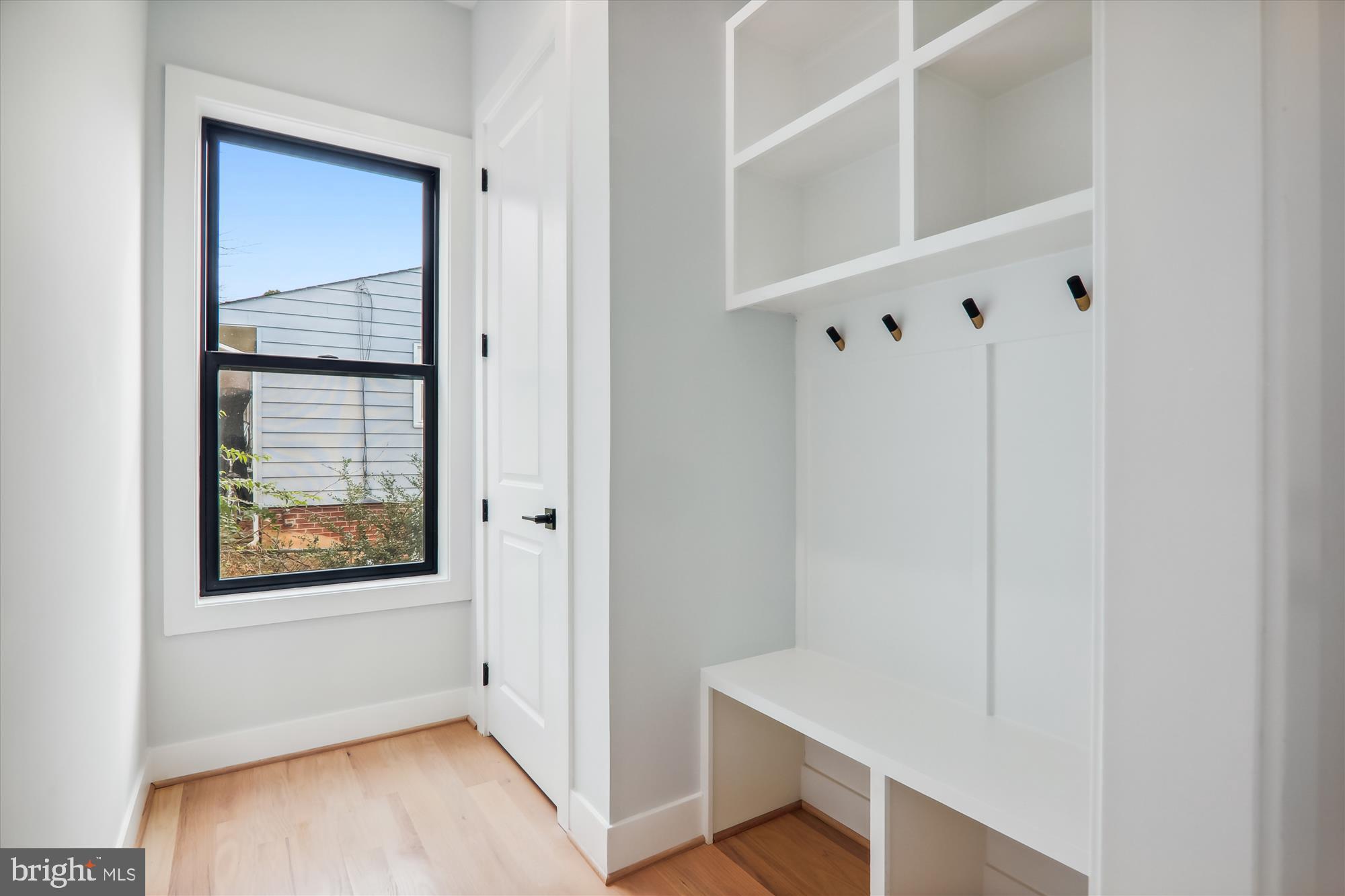 1927 Griffith Road Falls Church, VA 22043 - Photo 7 of 33 a view of an empty room with wooden floor and a window