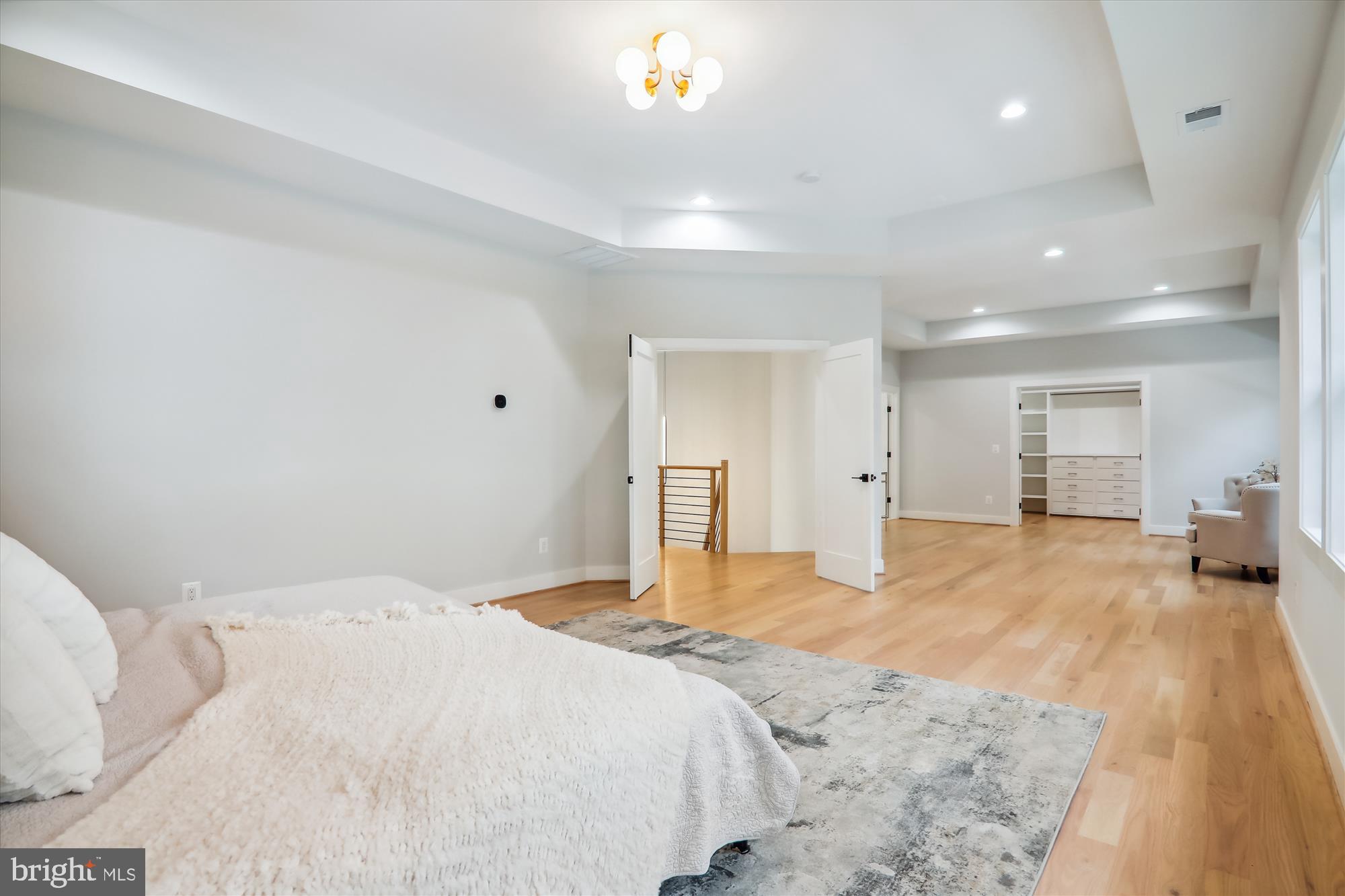1927 Griffith Road Falls Church, VA 22043 - Photo 8 of 33 a bedroom with a large bed and a chandelier