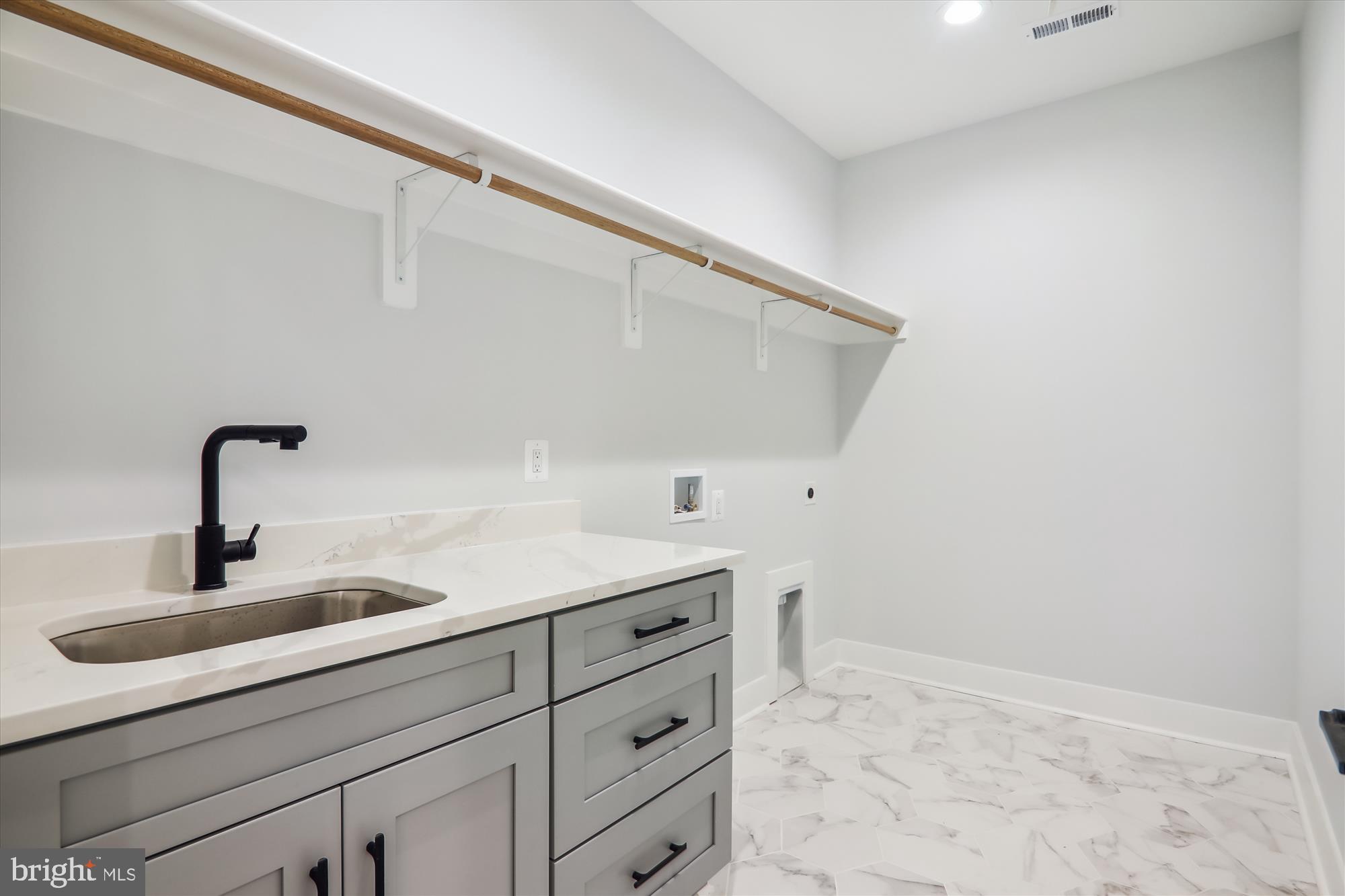 1927 Griffith Road Falls Church, VA 22043 - Photo 10 of 33 a kitchen with a sink and cabinets